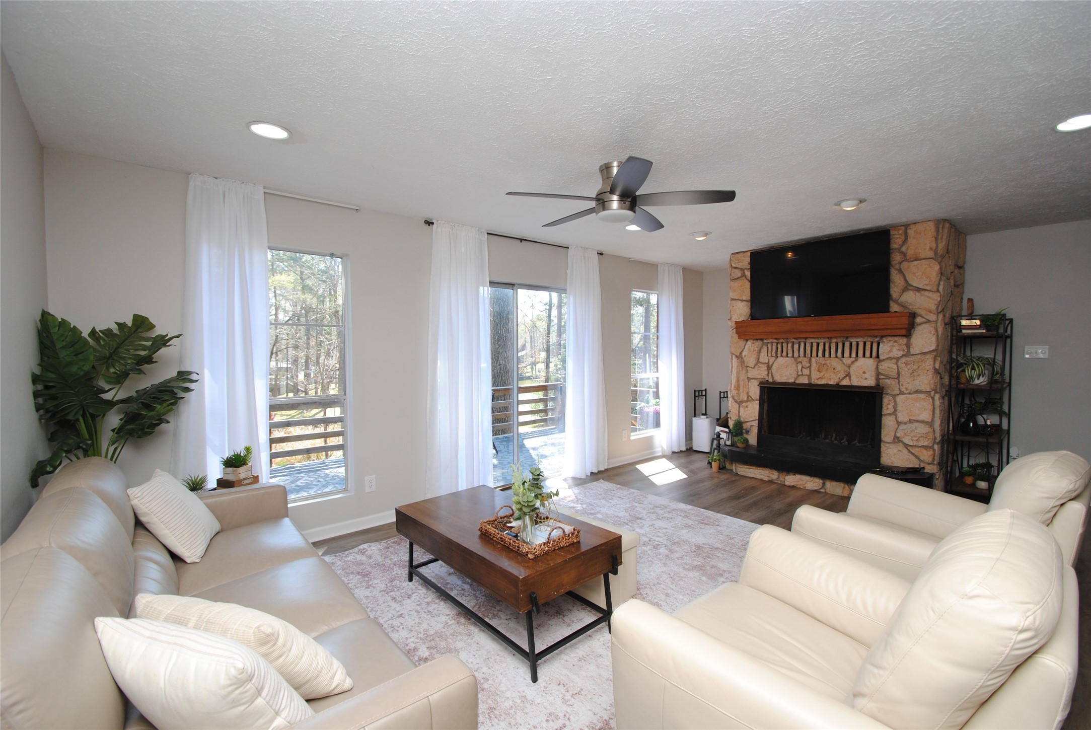 59 Paradise Loop Point Blank, TX 77364 - Photo 10 of 39 The living area overlooks the large deck as well as the lake.