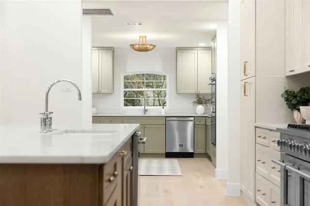 a kitchen with a sink and stove