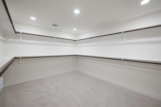 a view of an empty walk in closet