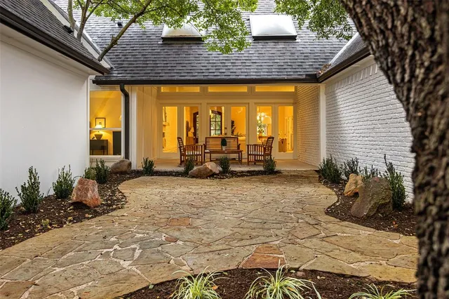 a view of a house with outdoor seating