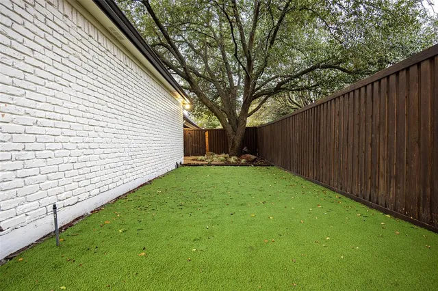 a backyard of a house with lots of green space