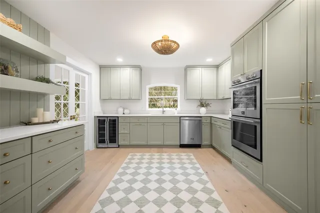 a kitchen with a sink cabinets and window