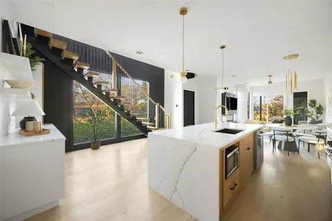 a open kitchen with sink and cabinets