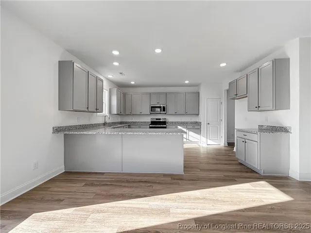 a view of kitchen with wooden floor