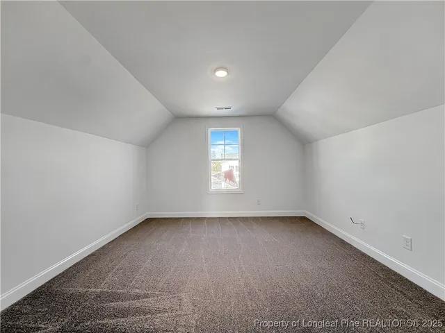 a view of a hallway with a white walls