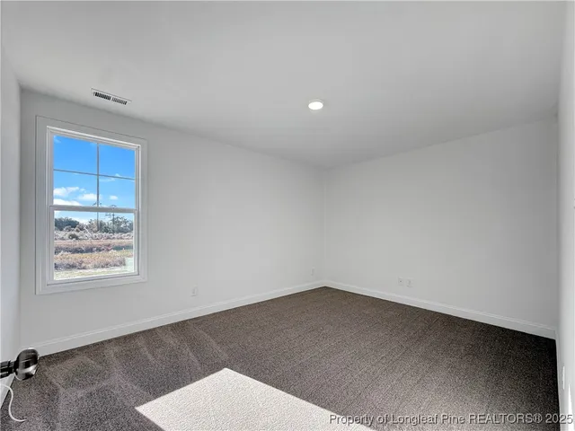 a view of a hallway with closet and entryway