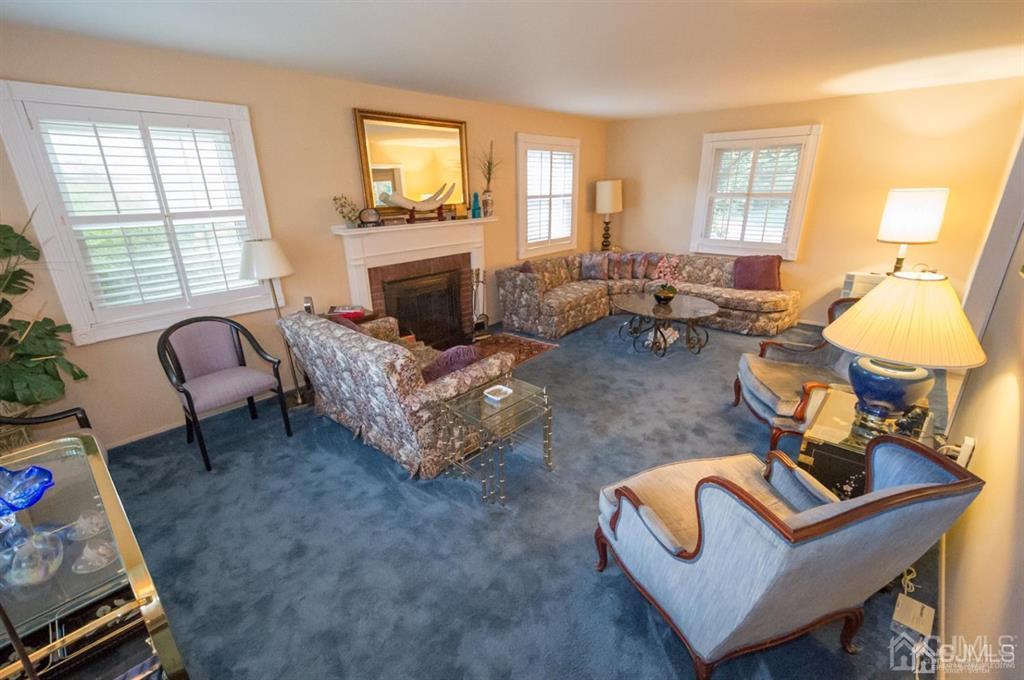 6 Tripplet Road Somerset, NJ 08873 - Photo 3 of 30 a living room with furniture and a fireplace