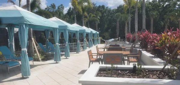 a view of a swimming pool with sitting area