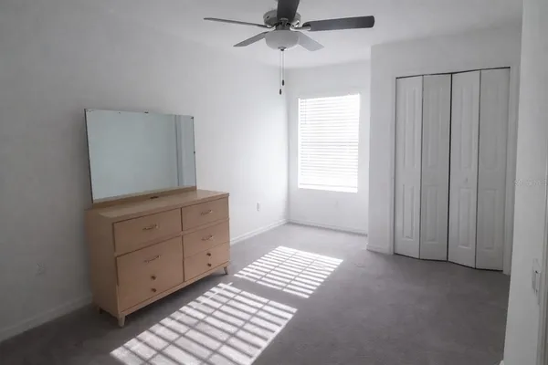a view of a bedroom with closet area