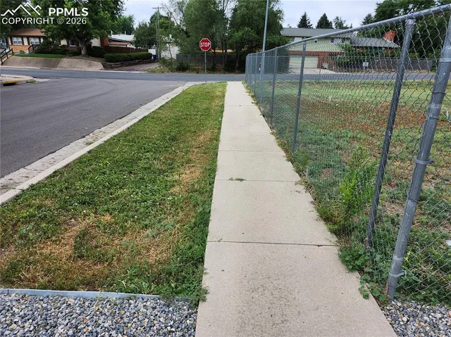 a view of a backyard with sitting area