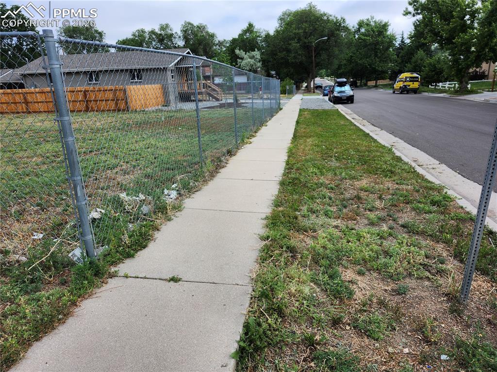 1504 Tweed Street Colorado Springs, CO 80909 - Photo 3 of 6 a view of a backyard with swimming pool