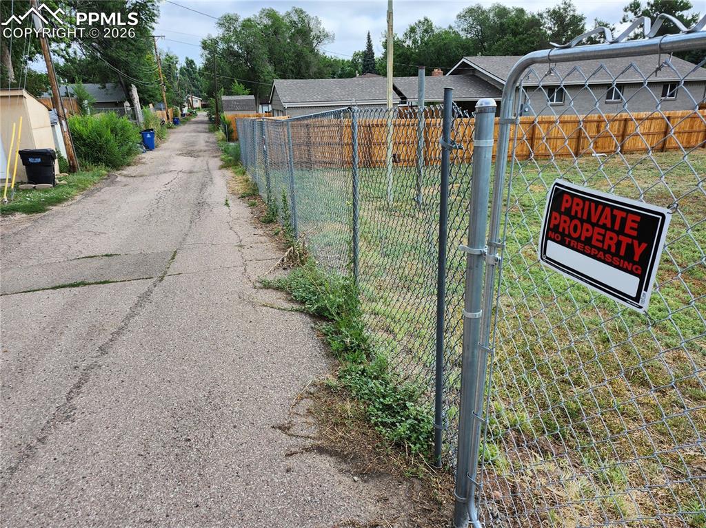 1504 Tweed Street Colorado Springs, CO 80909 - Photo 4 of 6 a view of a street with houses on both side