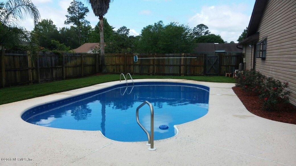 10823 Reading Road Jacksonville, FL 32257 - Photo 3 of 21 a view of a swimming pool with a yard