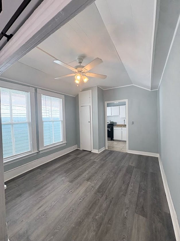 1810 24th Street Rear, Unit 3 Galveston, TX 77550 - Photo 4 of 8 a view of an empty room with window and wooden floor