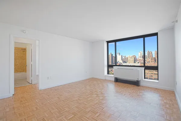 a view of an empty room with a window