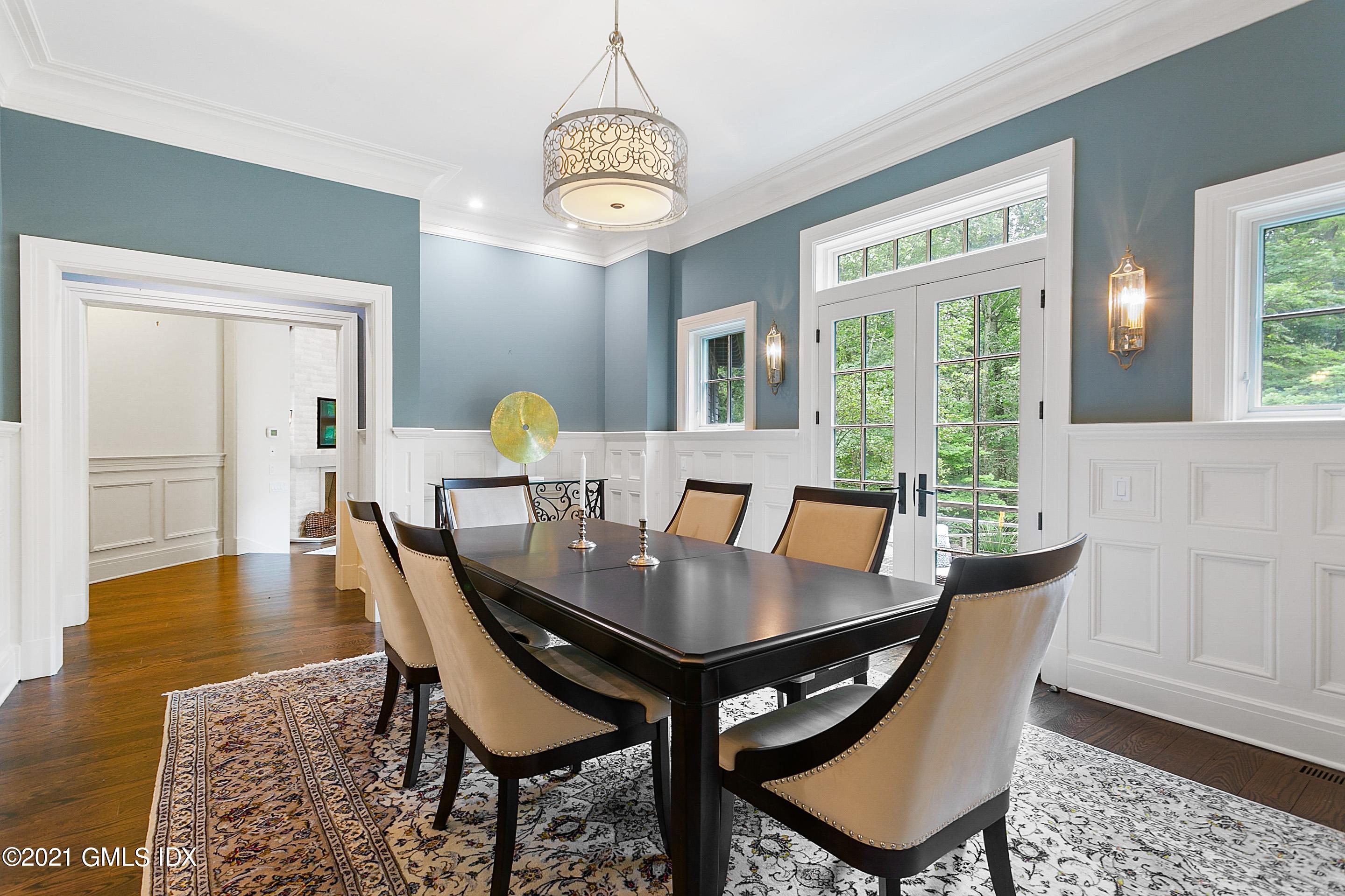 125 Cat Rock Road Cos Cob, CT 06807 - Photo 11 of 45 a view of a dining room with furniture window and wooden floor