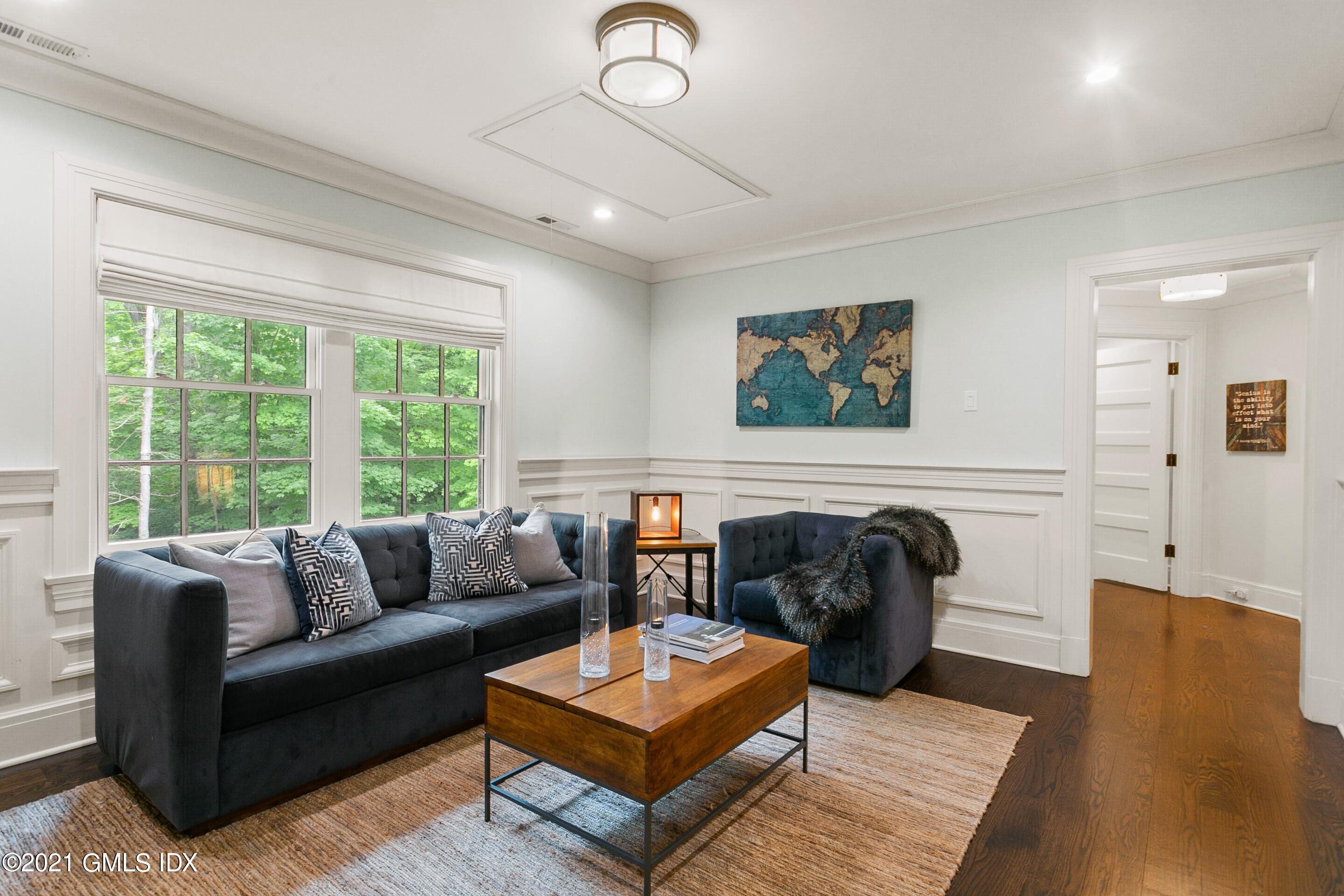 125 Cat Rock Road Cos Cob, CT 06807 - Photo 15 of 45 a living room with furniture rug and window