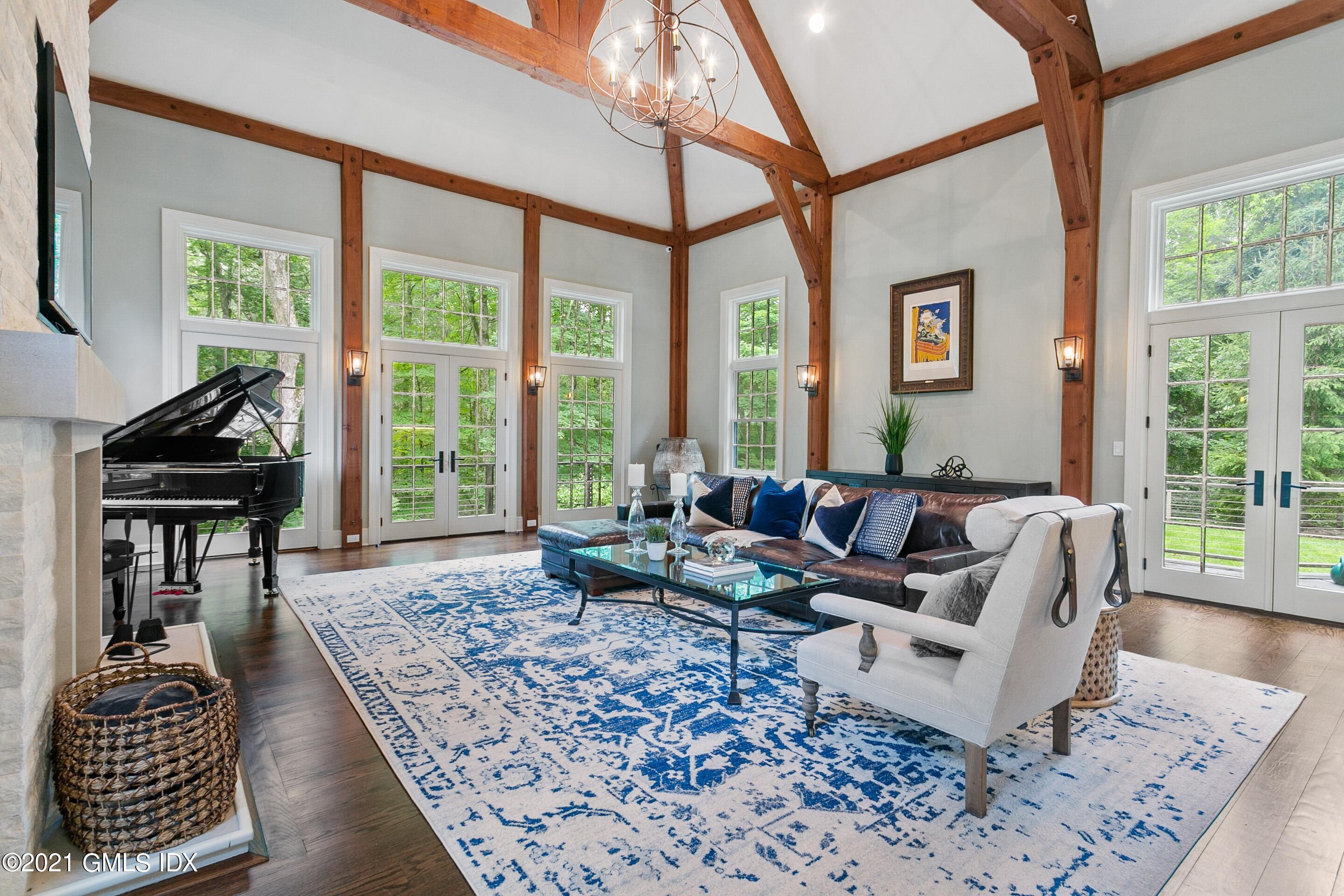 125 Cat Rock Road Cos Cob, CT 06807 - Photo 2 of 45 a living room with furniture and a floor to ceiling window