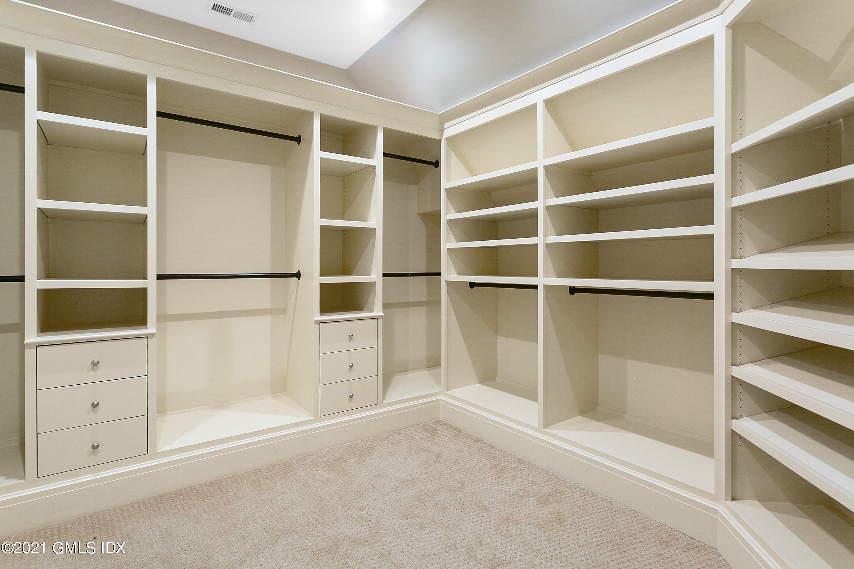 125 Cat Rock Road Cos Cob, CT 06807 - Photo 21 of 45 a view of walk in closet with empty racks