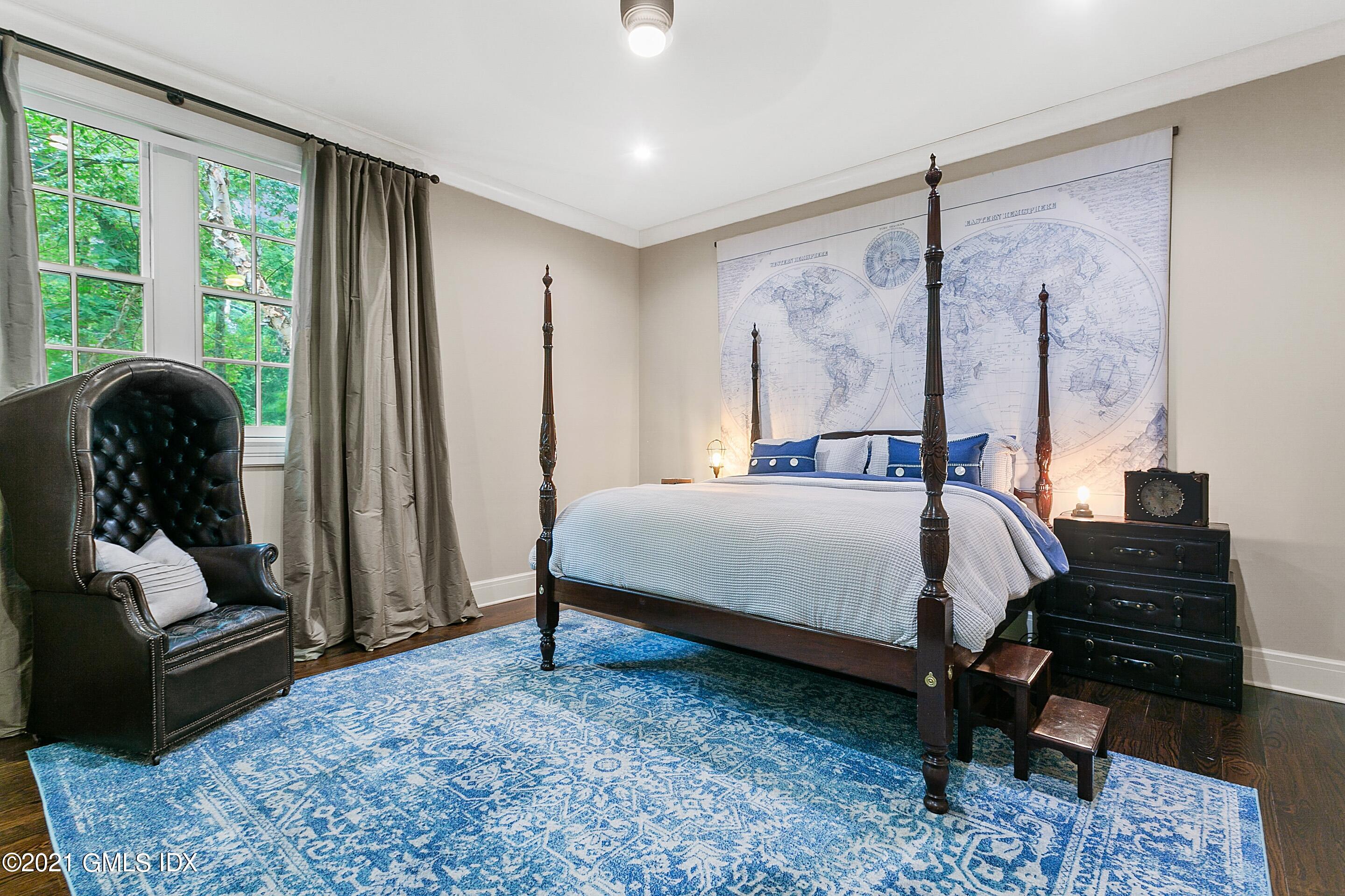 125 Cat Rock Road Cos Cob, CT 06807 - Photo 27 of 45 a bedroom with a bed window and a couch