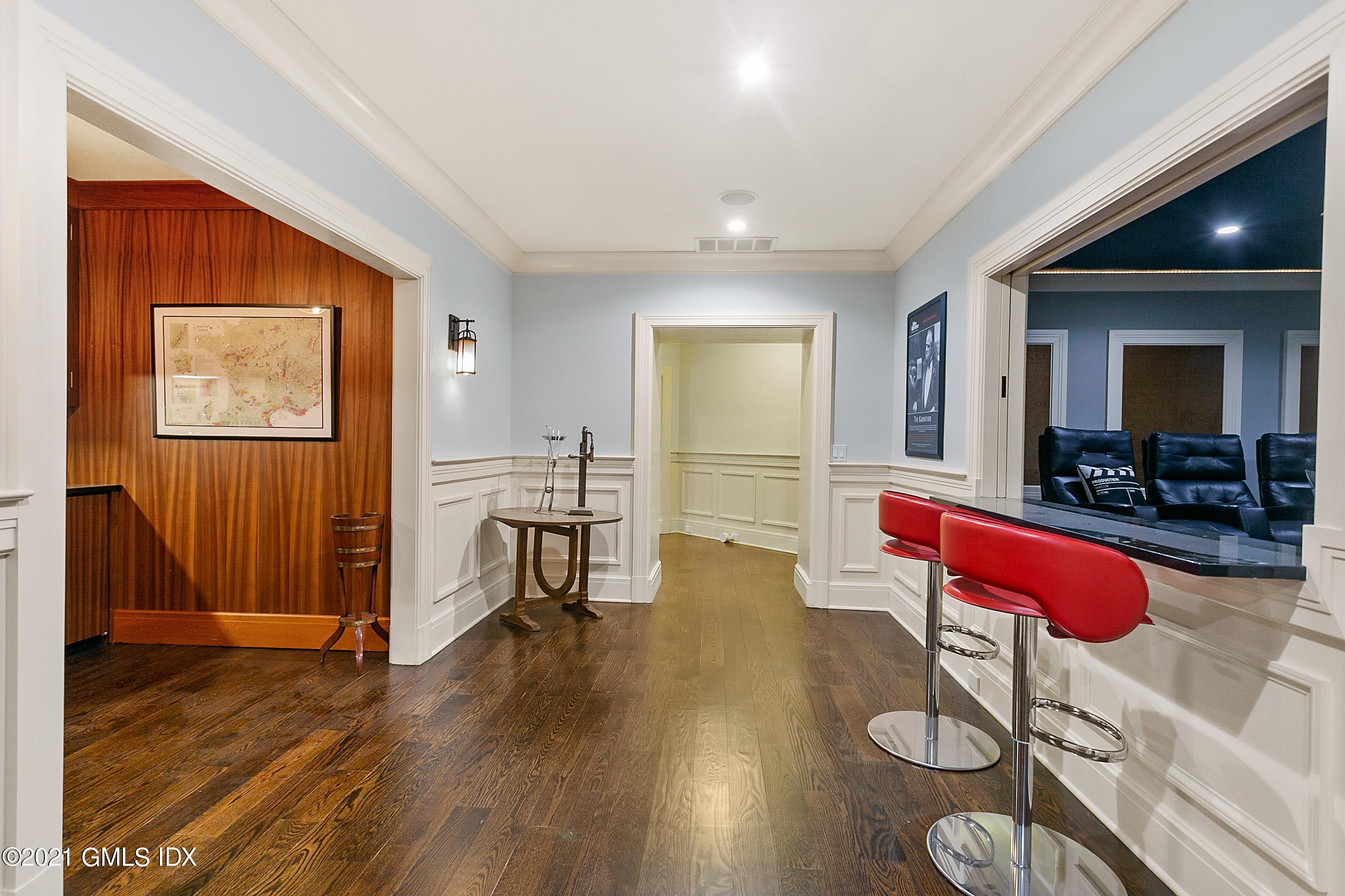 125 Cat Rock Road Cos Cob, CT 06807 - Photo 28 of 45 a living room with furniture and wooden floor