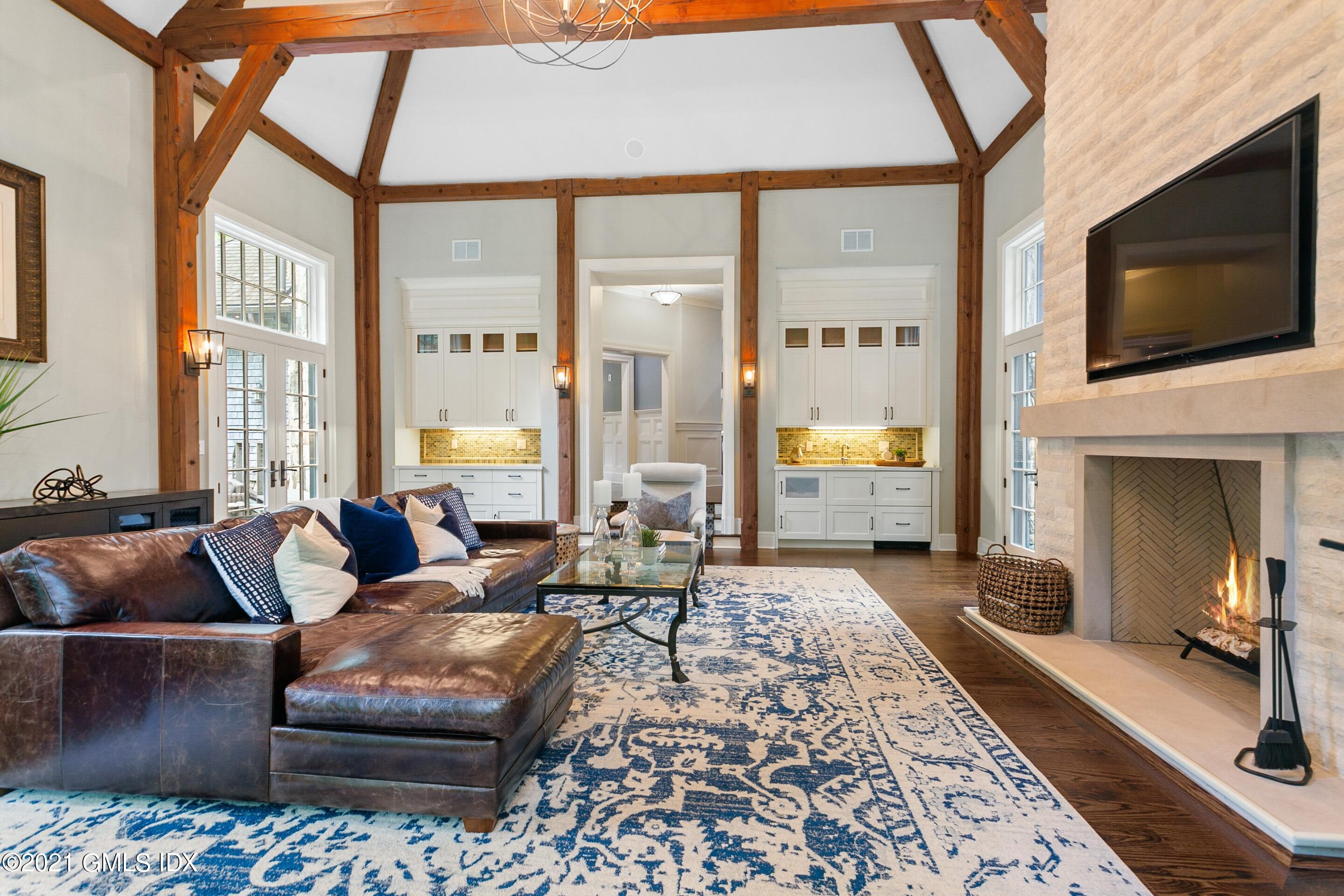 125 Cat Rock Road Cos Cob, CT 06807 - Photo 3 of 45 a living room with furniture and a flat screen tv