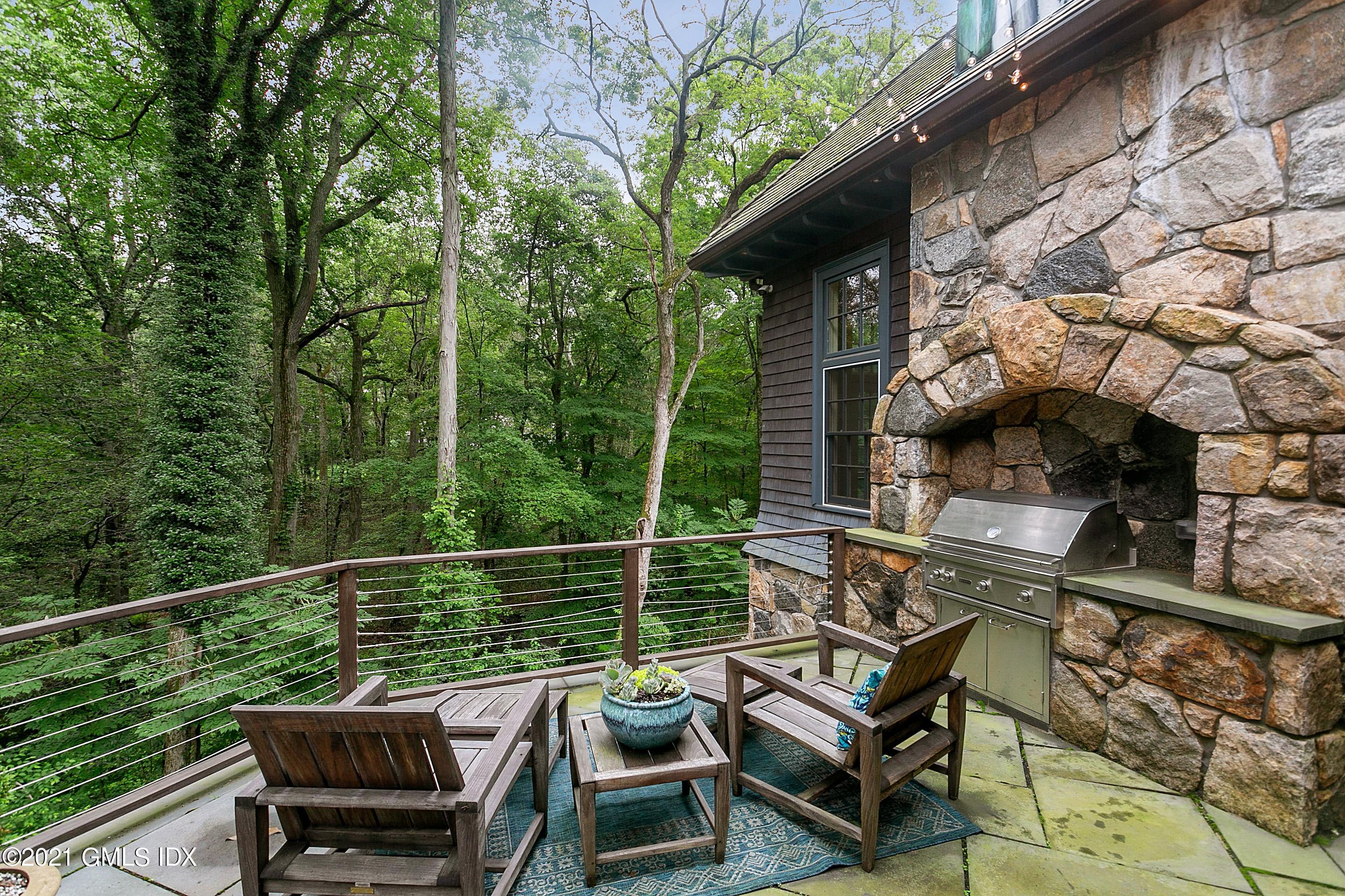 125 Cat Rock Road Cos Cob, CT 06807 - Photo 36 of 45 a view of a chair and table on the balcony