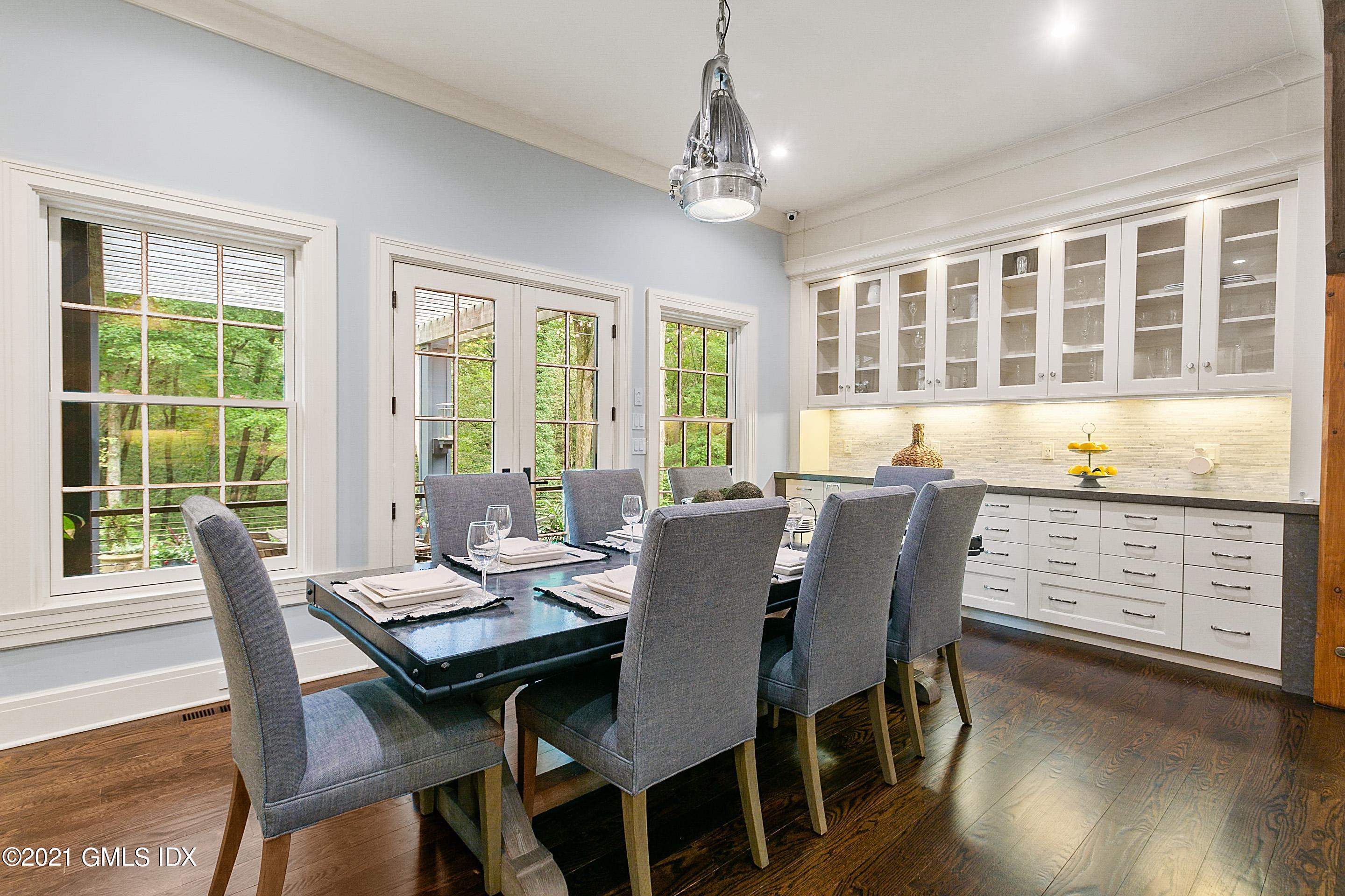 125 Cat Rock Road Cos Cob, CT 06807 - Photo 6 of 45 a view of a dining room with furniture window and wooden floor