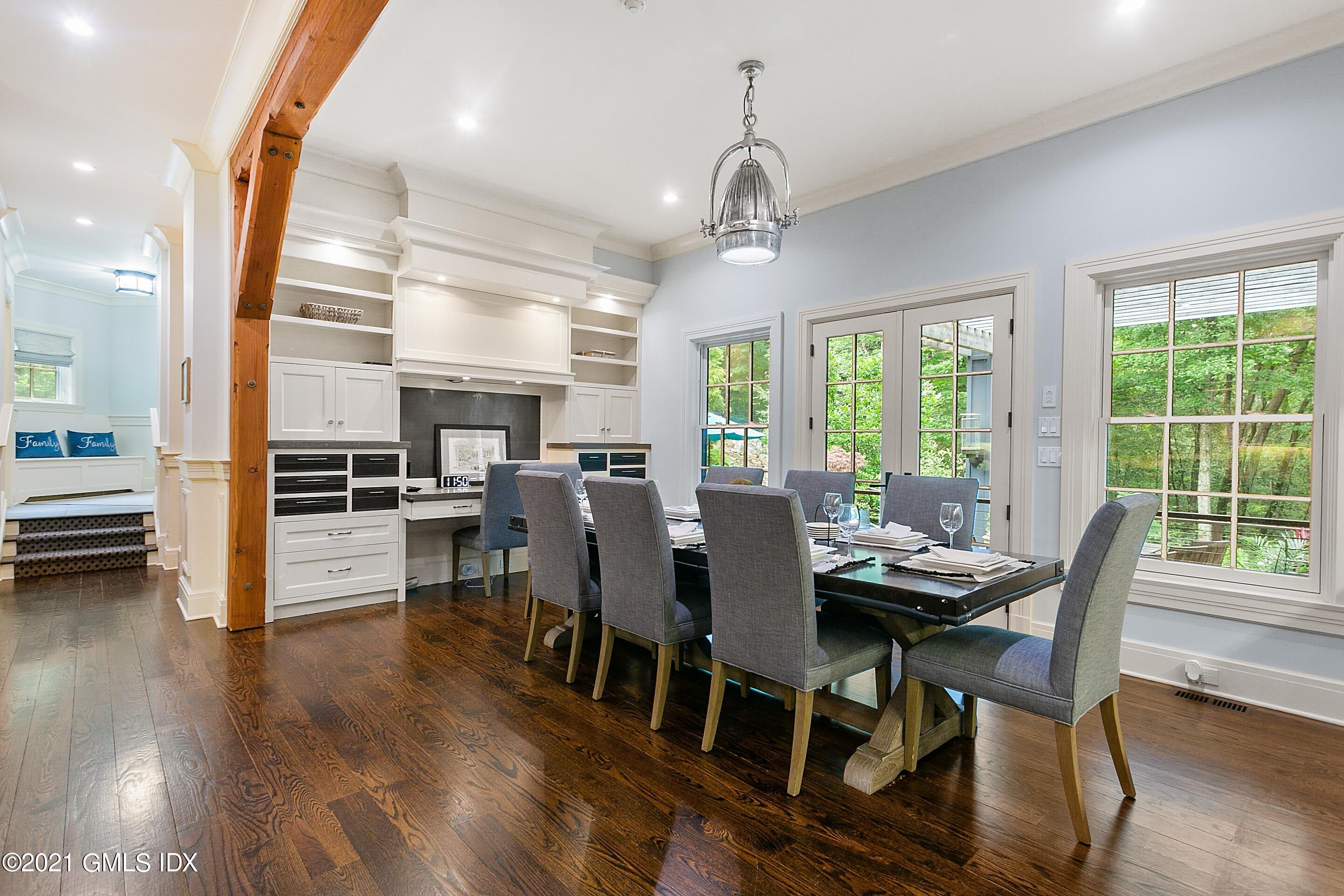 125 Cat Rock Road Cos Cob, CT 06807 - Photo 7 of 45 a view of a dining room with furniture window and wooden floor