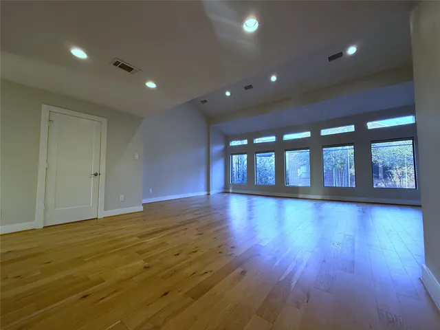 a view of an entryway with wooden floor