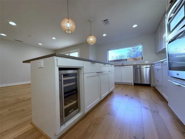 a view of a hallway with washer and dryer