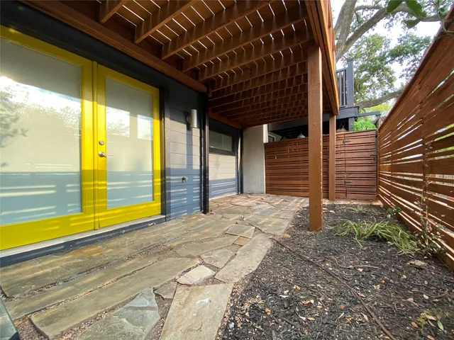 a view of backyard with large windows