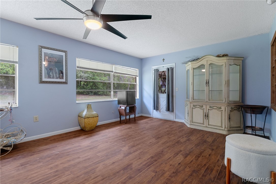 3355 South Highlands Avenue Inverness, FL 34452 - Photo 15 of 30 a living room with furniture and a large window