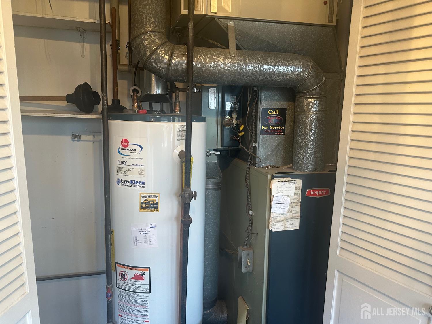 22 Richford Road Kendall Park, NJ 08824 - Photo 21 of 23 a kitchen with refrigerator and table