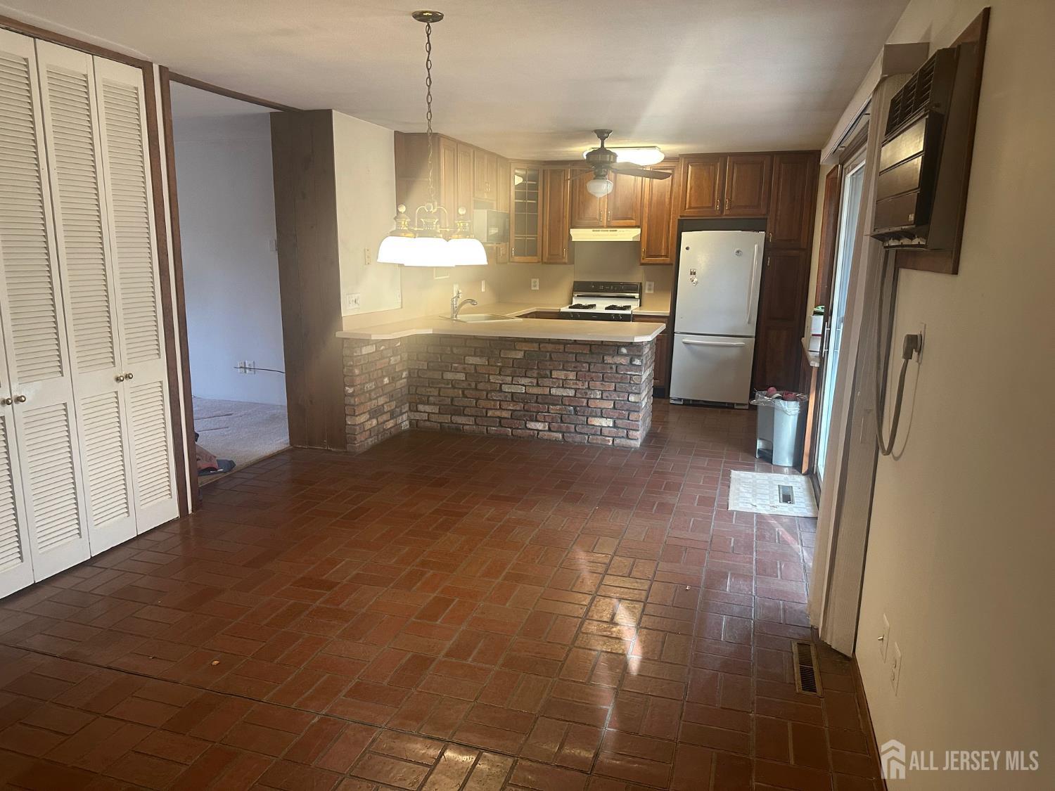 22 Richford Road Kendall Park, NJ 08824 - Photo 7 of 23 a view of a kitchen with a refrigerator
