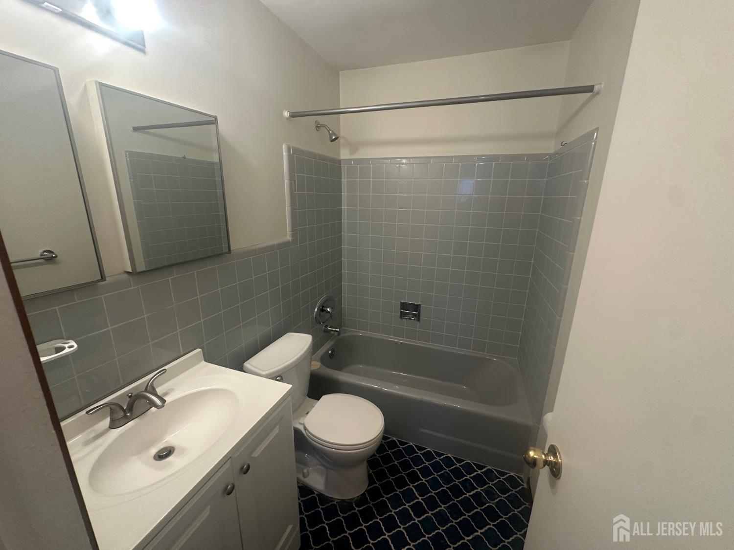22 Richford Road Kendall Park, NJ 08824 - Photo 10 of 23 a bathroom with a sink toilet and shower