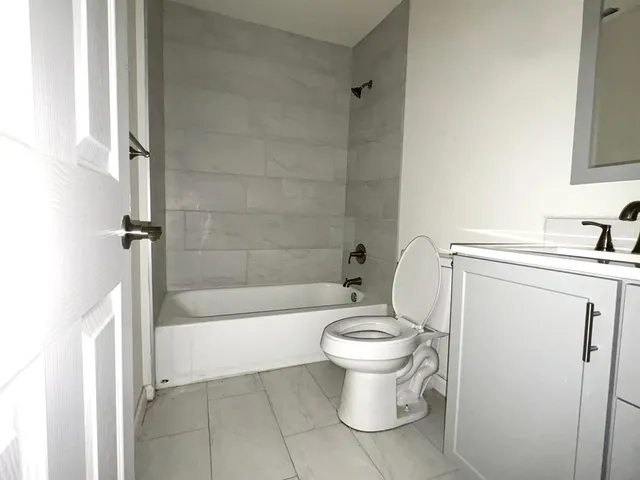 a bathroom with a sink toilet and bathtub