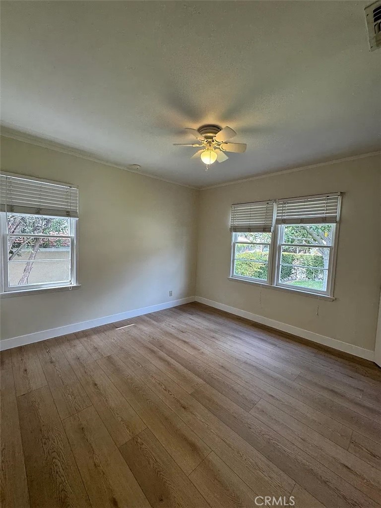 1852 Alpha Road Glendale, CA 91208 - Photo 22 of 29 an empty room with wooden floor and window