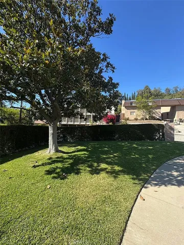 a view of a lake with a house in the background