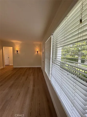 a view of a balcony with wooden floor