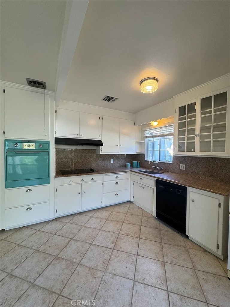 1852 Alpha Road Glendale, CA 91208 - Photo 10 of 29 a kitchen with stainless steel appliances granite countertop a stove a sink and a microwave