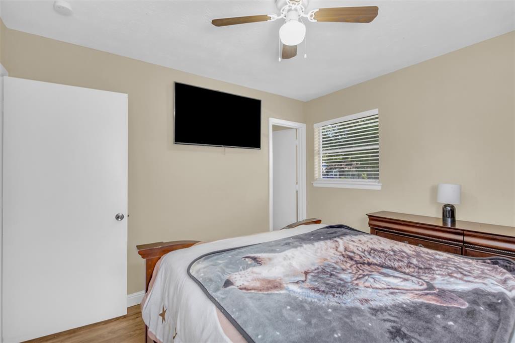 2311 Arcady Lane Lancaster, TX 75134 - Photo 15 of 22 a bedroom with a bed and a flat screen tv