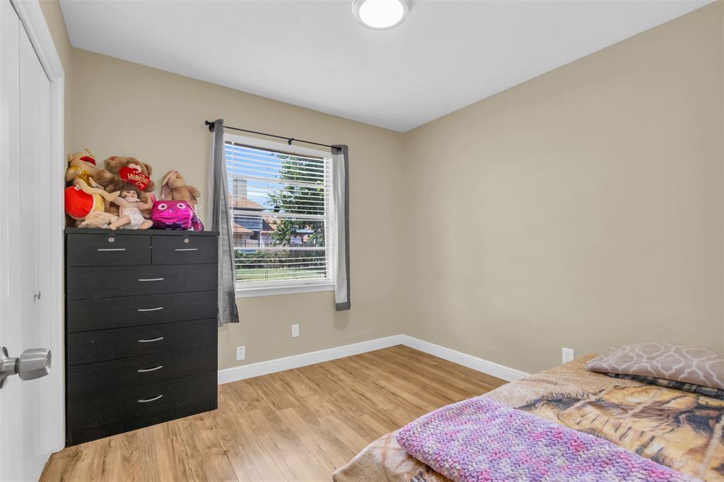 2311 Arcady Lane Lancaster, TX 75134 - Photo 17 of 22 a bedroom with a bed and a window