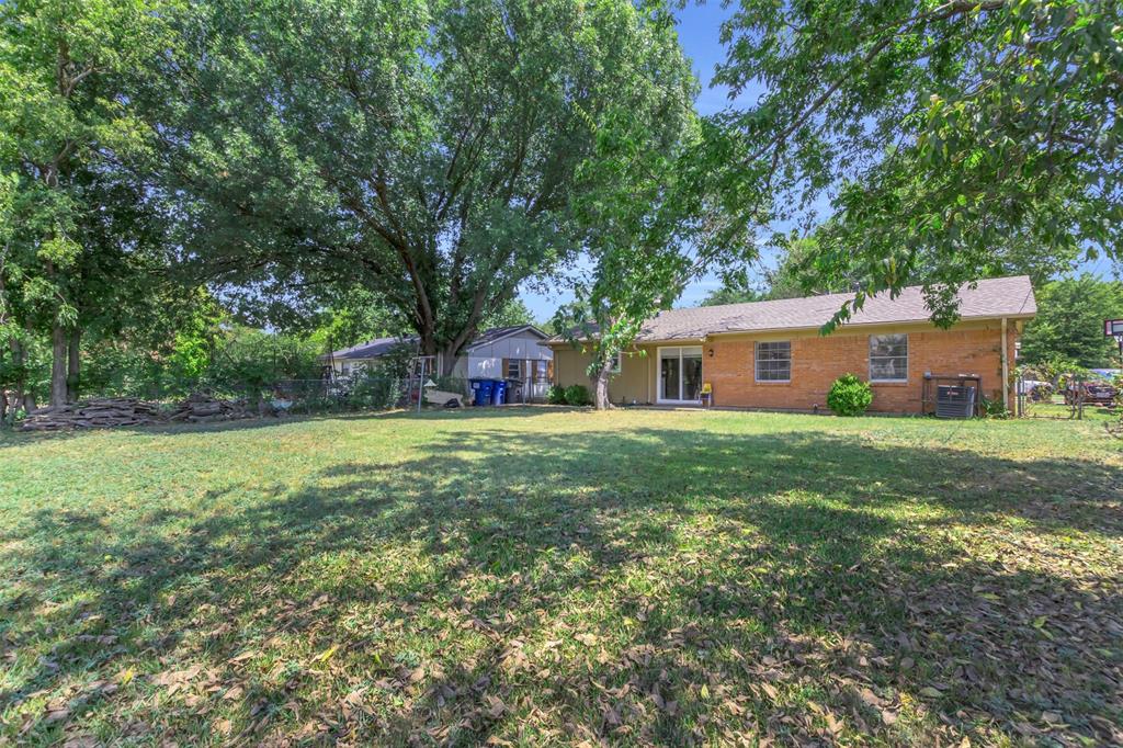2311 Arcady Lane Lancaster, TX 75134 - Photo 20 of 22 a front view of house with yard and green space