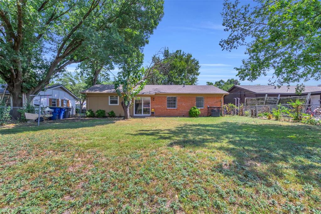 2311 Arcady Lane Lancaster, TX 75134 - Photo 22 of 22 a front view of a house with garden