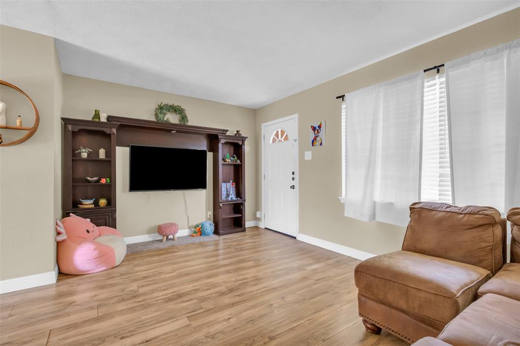2311 Arcady Lane Lancaster, TX 75134 - Photo 3 of 22 a living room with furniture and a flat screen tv