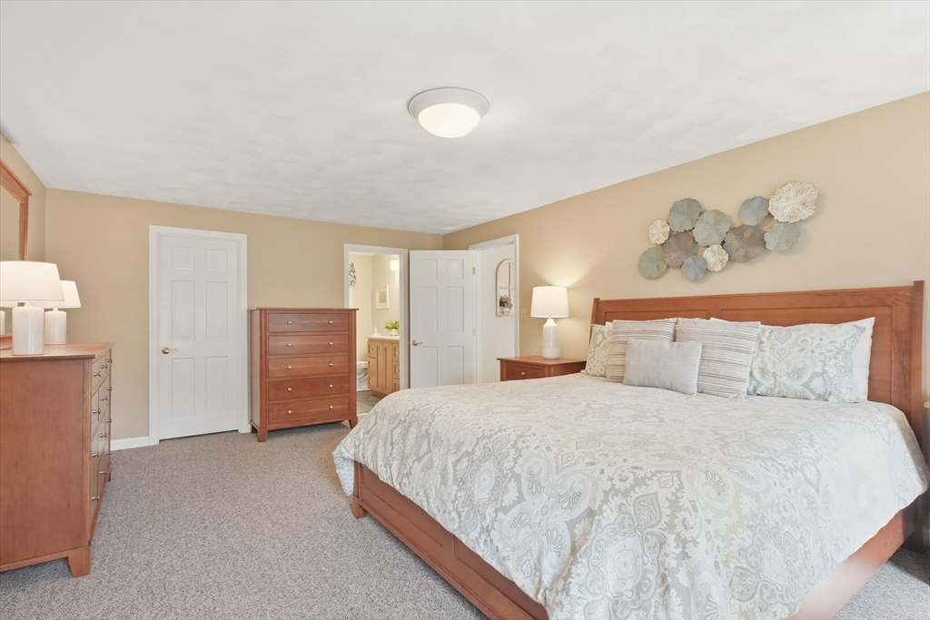 9 Fazio Farm Road Georgetown, MA 01833 - Photo 24 of 42 a bedroom with a bed and a refrigerator