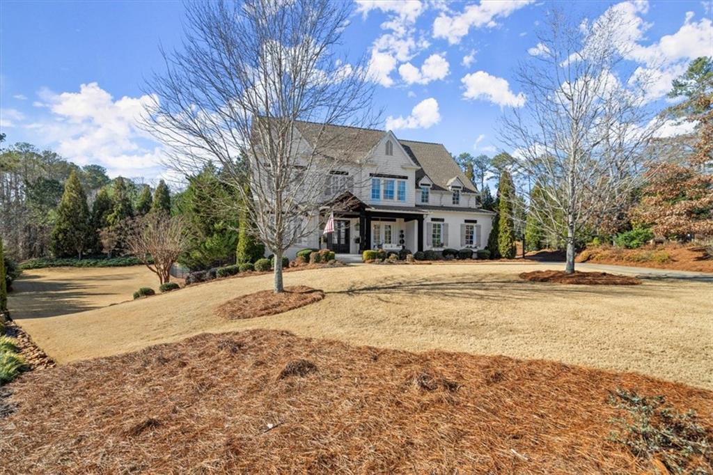 13902 Tree Loft Road Milton, GA 30004 - Photo 1 of 1 a view of a house with snow on the road