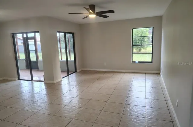 a view of an empty room with glass door