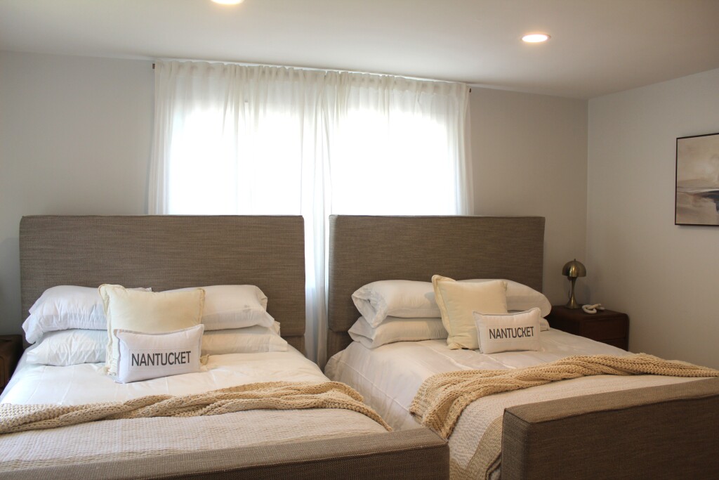 33 Bartlett Road Nantucket, MA 02554 - Photo 13 of 29 a bedroom with two beds and a large window